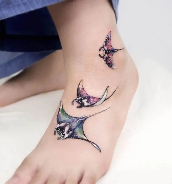 Manta foot tattoo, a graceful and flowing design featuring a manta ray, evoking ocean beauty