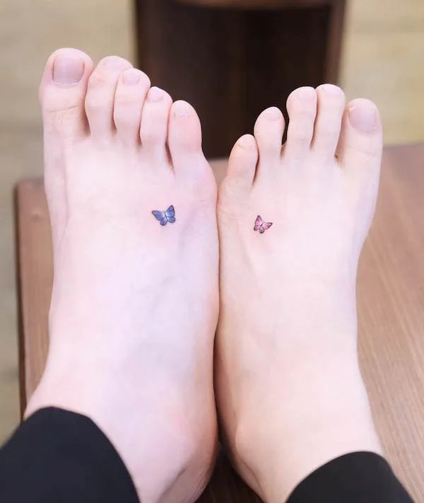 Matching tiny butterfly foot tattoos, symbolizing undying love and commitment, ideal for couples