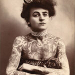 Maud Wagner, one of the earliest known female tattoo artists, showcasing her tattoos.