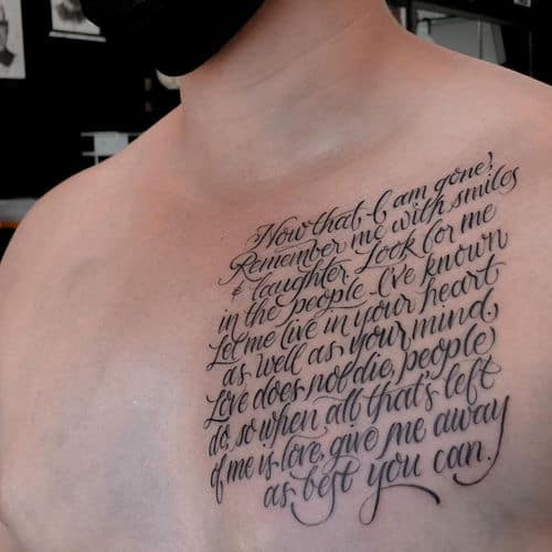 A memorial tattoo with angel wings and a name on a man's back, a touching tribute