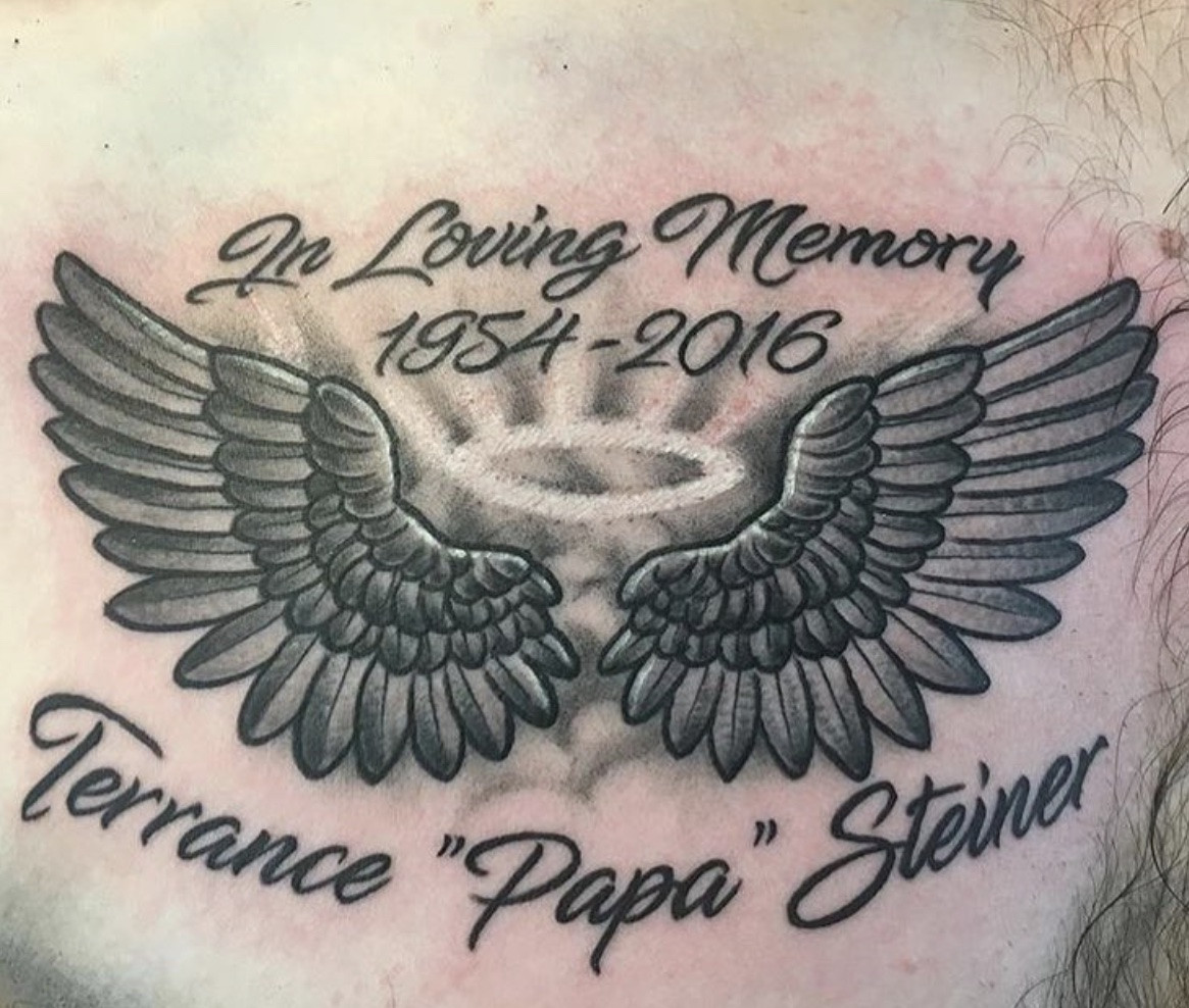 Touching memorial angel tattoo, symbolizing remembrance and hope for departed loved ones.