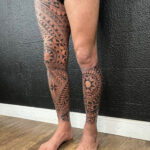 Detailed leg sleeve tattoo for men featuring intricate patterns