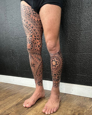 Detailed leg sleeve tattoo for men featuring intricate patterns