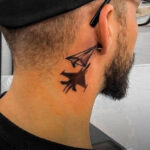 Minimalist geometric side neck tattoo for men, showcasing clean lines and a simple triangle design.