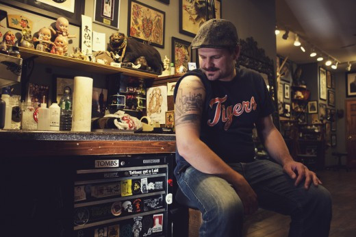 Mike McNelis, a regular at Three Kings Tattoo in Brooklyn, showcases his tattoos.