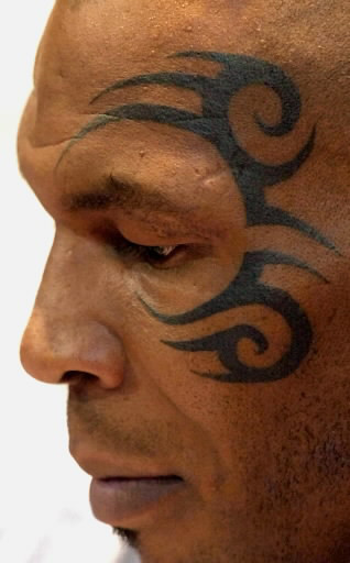 Close-up of Mike Tyson's iconic tribal face tattoo, a subject of copyright debate and cultural discussion.