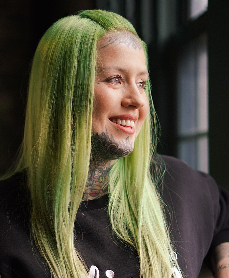 Miley, a versatile tattoo artist specializing in Blackwork and Realism at Milwaukee's Ghost Light Tattoo Parlor