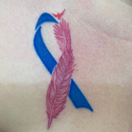 Baby Loss Awareness ribbon tattoo with feather and birds, symbolizing remembrance