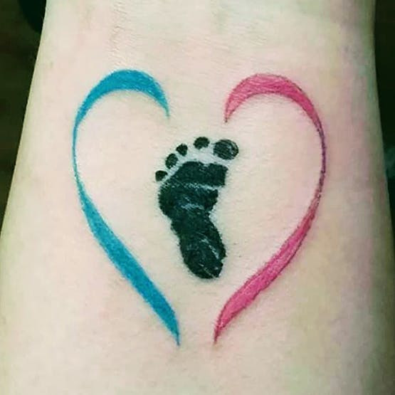 Footprint and baby loss awareness ribbon miscarriage tattoo on wrist.