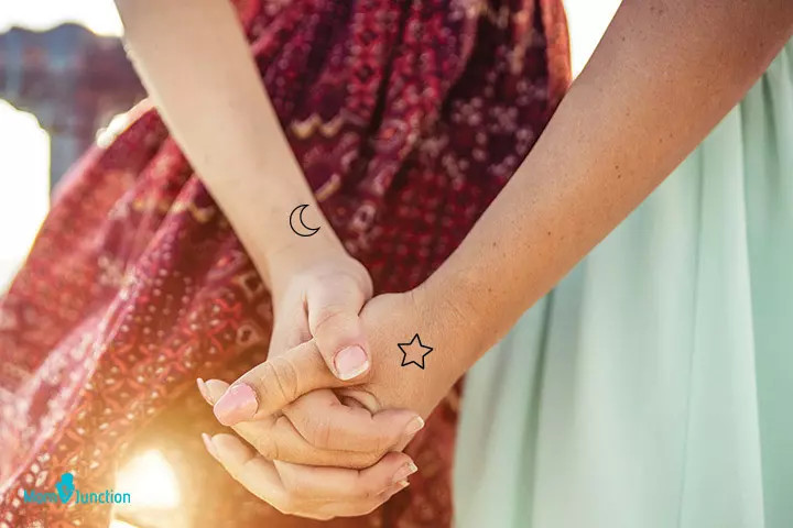 Moon and star mother-daughter tattoo, representing eternal connection