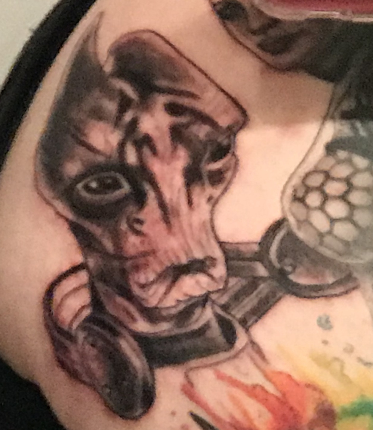 Black and grey Mordin tattoo, showcasing the linework of a Mass Effect themed gaming tattoo