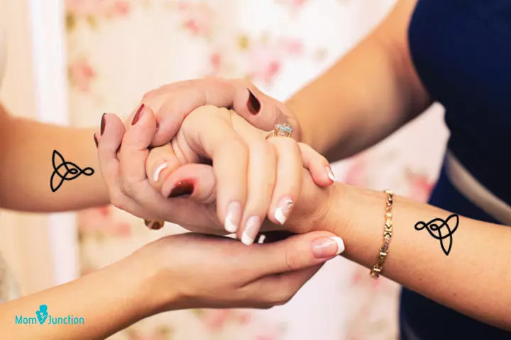 Celtic knot mother-daughter tattoo, signifying an unbreakable bond