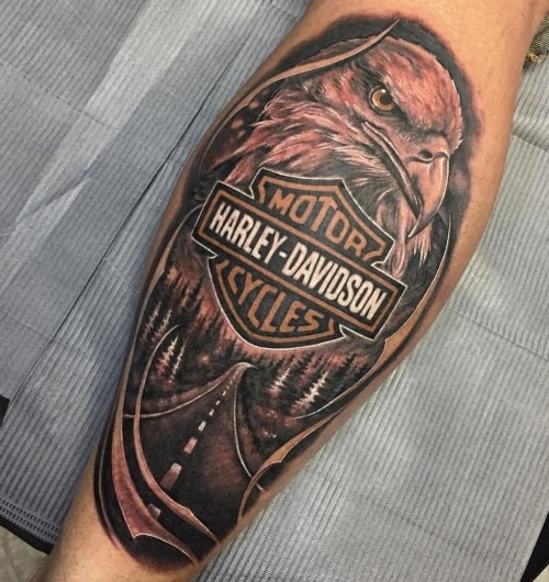 Motorcycle engine tattoo on a man's arm