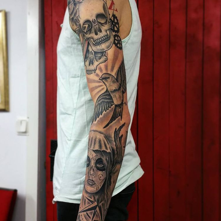 badass sleeve tattoo with cultural symbols