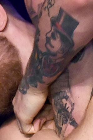 Gentleman with a top hat tattoo on the back of Conor McGregor's forearm