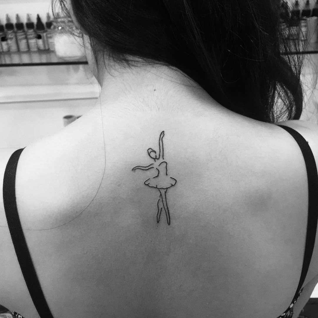 Unique ballerina tattoo for women, dynamic and elegant design showcasing movement