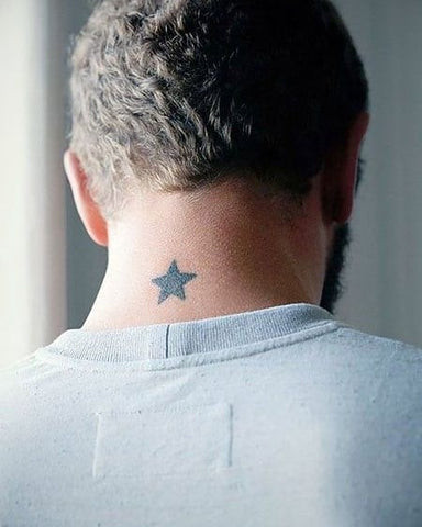 Star side neck tattoo for men, featuring a cluster of small stars behind the ear.