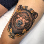 Neo traditional bear tattoo showcasing bold lines and vibrant colors.