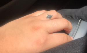 Nicole's finger cross tattoo