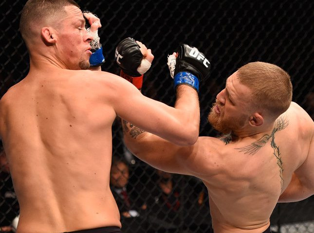 Conor McGregor showcasing his winged crucifix neck tattoo during a UFC face-off