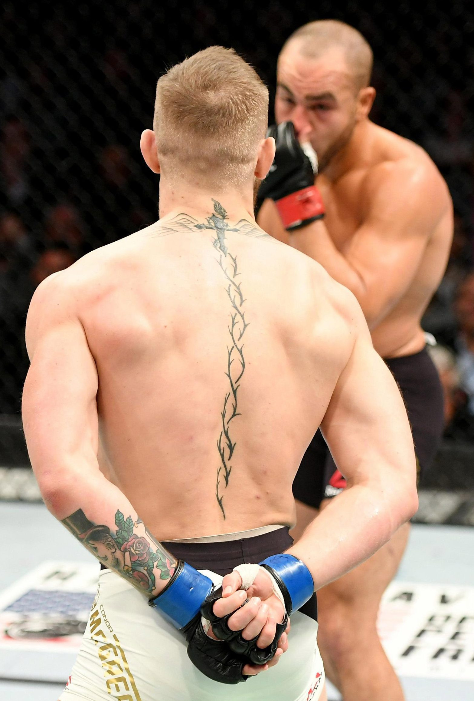 Detailed view of the helix of thorns tattoo running down Conor McGregor's back