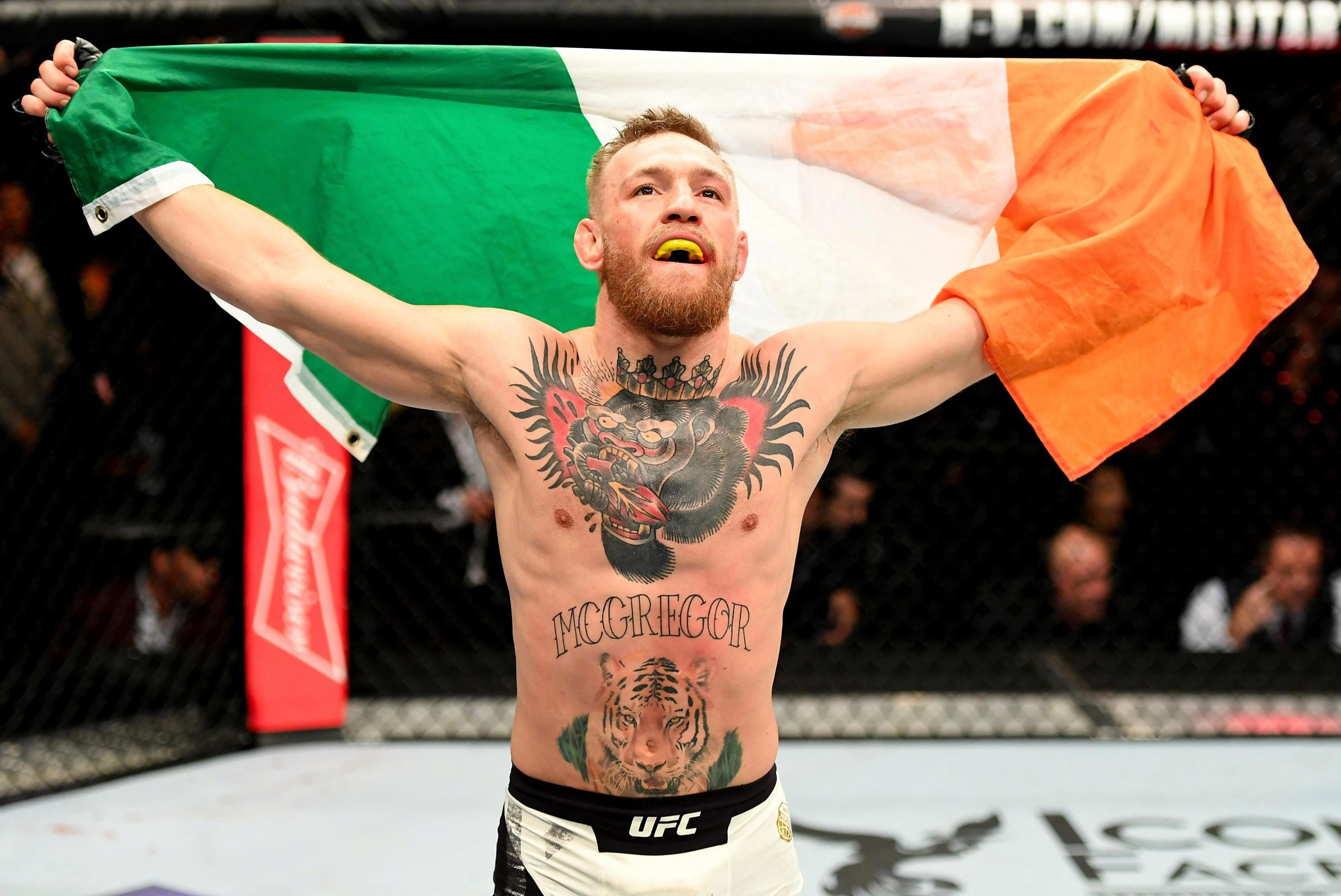 Conor McGregor's chest tattoo featuring a crowned gorilla holding a heart