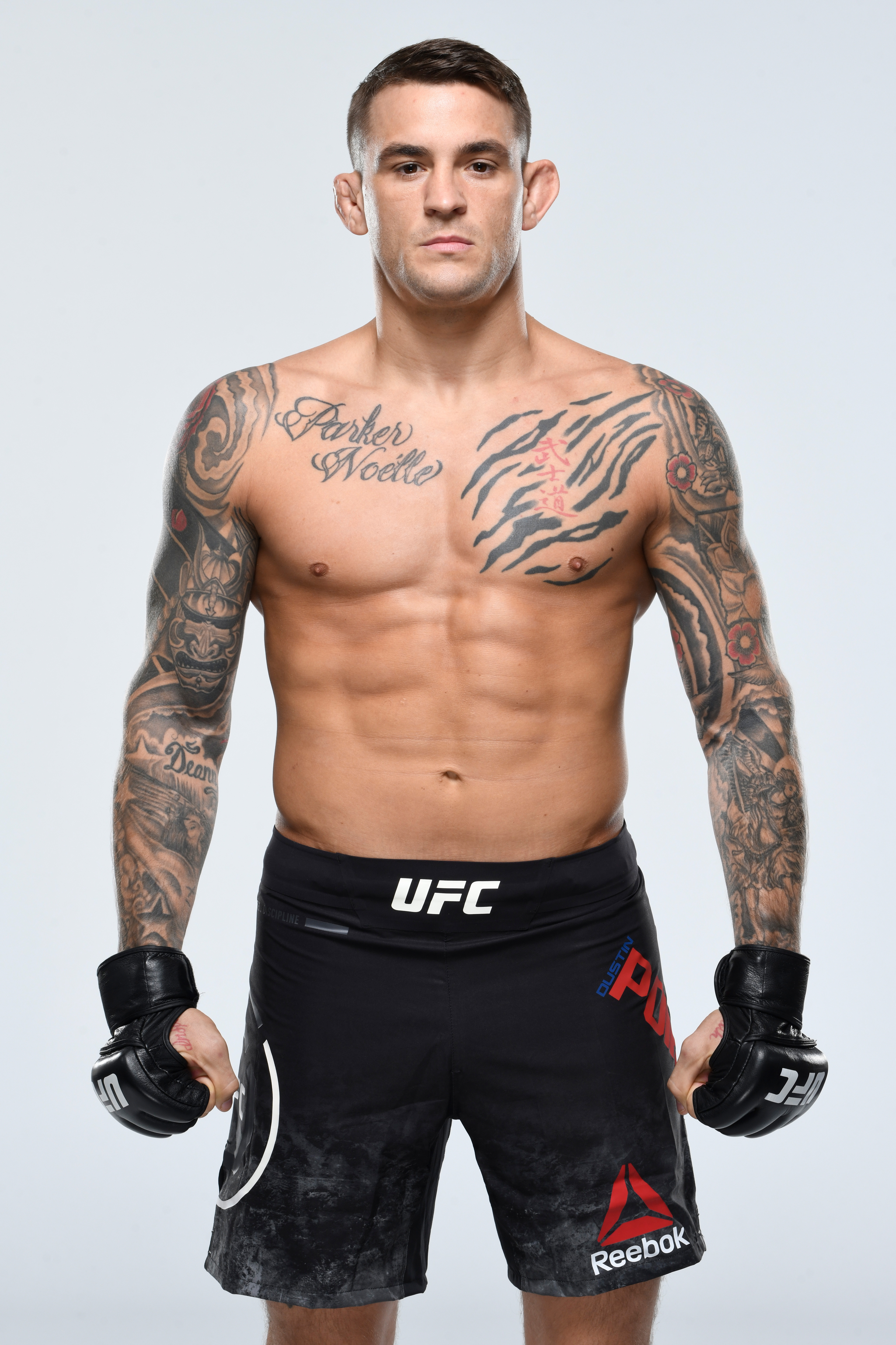 Dustin Poirier revealing tattoos dedicated to the women in his life