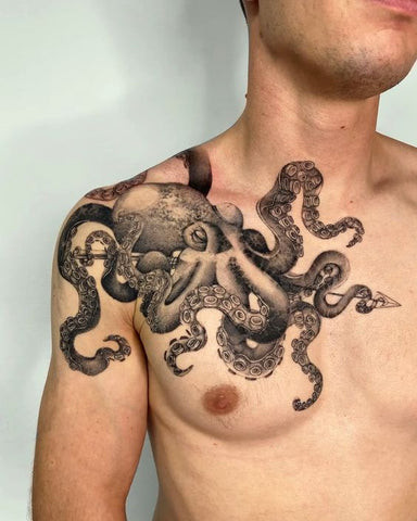 Octopus chest tattoo with tentacles wrapping around, symbolizing mystery, intelligence, and adaptability.