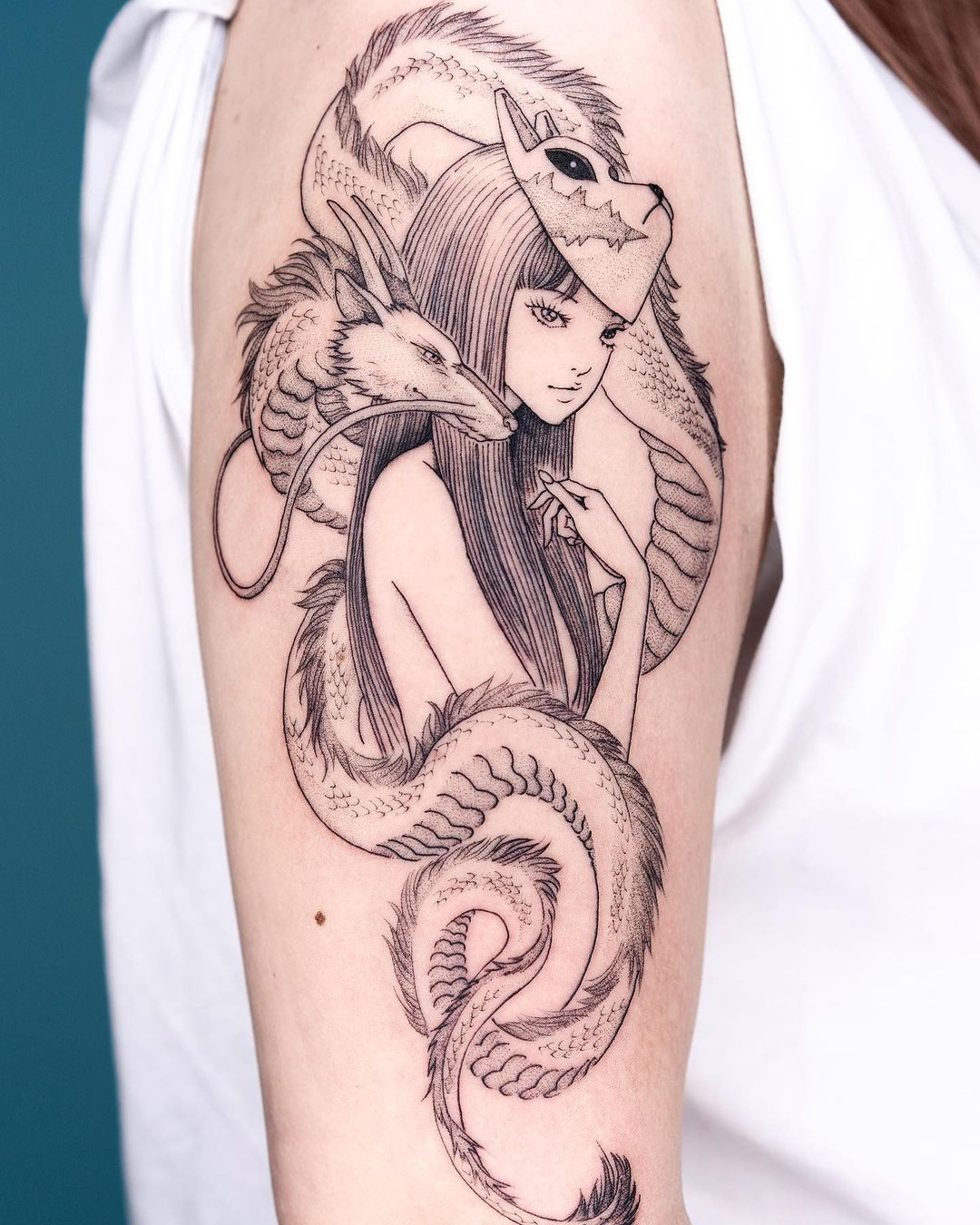 Anime-inspired tattoo on arm, stylized character design