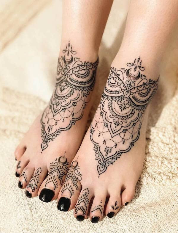 Ornamental foot tattoo with mandala design, representing wholeness, life cycles, and intricate geometric beauty