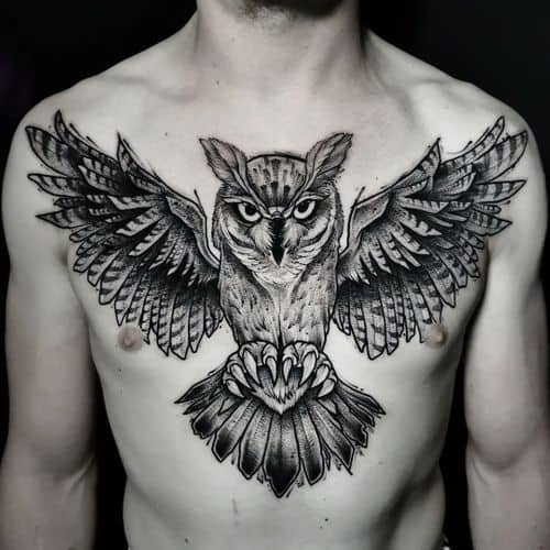 Geometric owl tattoo design on a man's chest