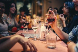 People Talking At a Restaurant Drinking Wine