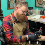 Matt Burgdorf's portrait, showcasing his dedication to traditional tattoo artistry and his connection with 713 Tattoo.