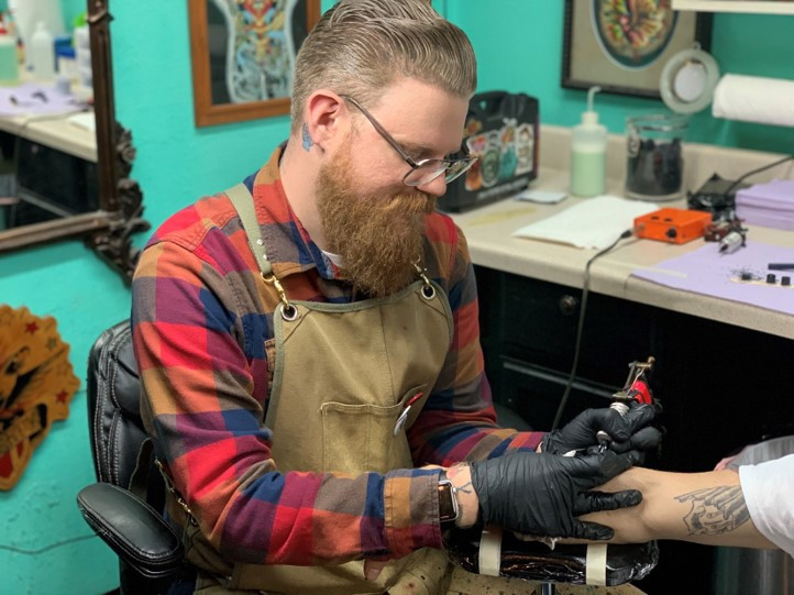 Matt Burgdorf's portrait, showcasing his dedication to traditional tattoo artistry and his connection with 713 Tattoo.