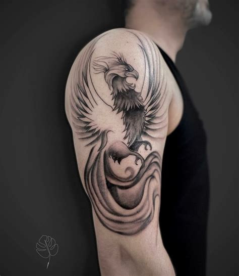 Phoenix tattoos designed for men, featuring bold lines, darker colors, and powerful imagery of flight and flames.