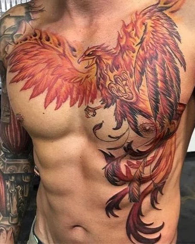 Phoenix chest tattoo rising from ashes, symbolizing rebirth, renewal, and strength.