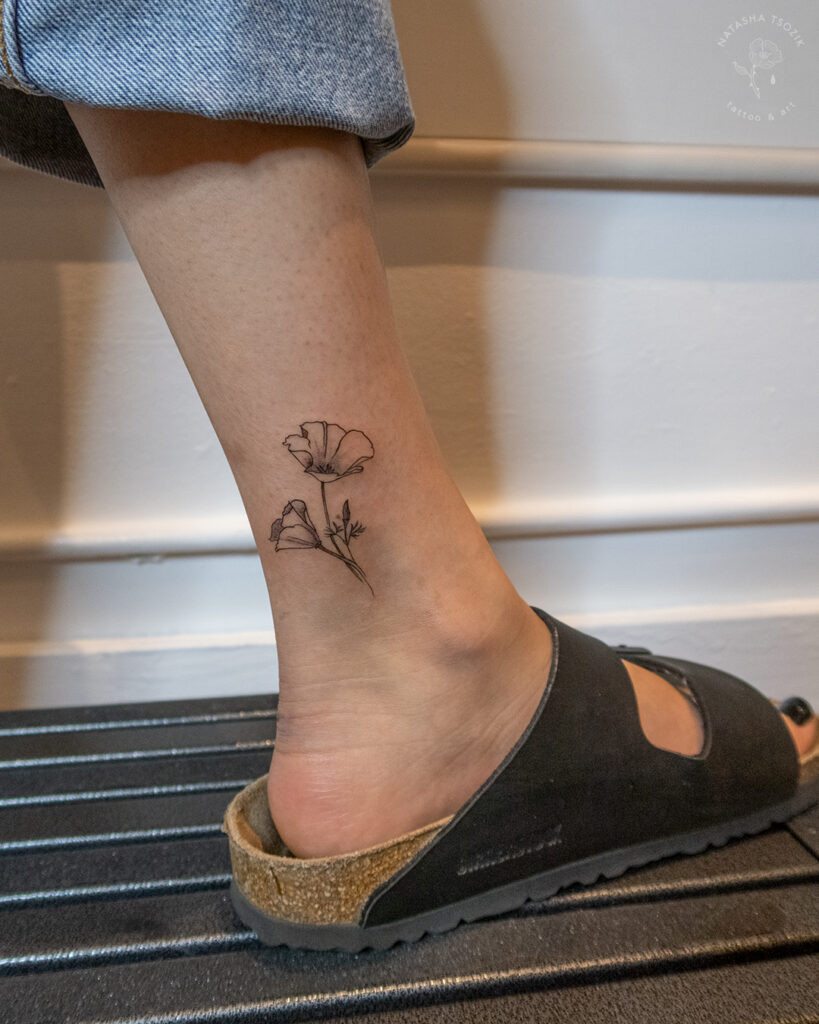 Poppy Flower tattoo on an ankle by Natasha Tsozik