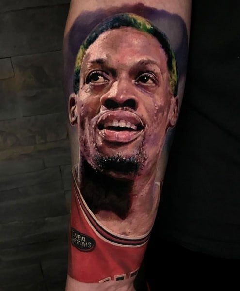 Two portrait tattoos on men, one on the forearm with a realistic portrait of a loved one and another on the arm with a celebrity portrait.