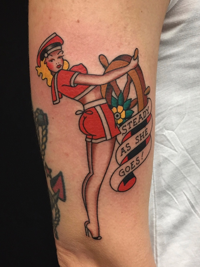 Sailor Jerry inspired pin-up tattoo by Jose Chalarca, showcasing classic traditional style. Steady as she goes!
