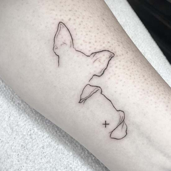 Minimalist dog ears tattoo