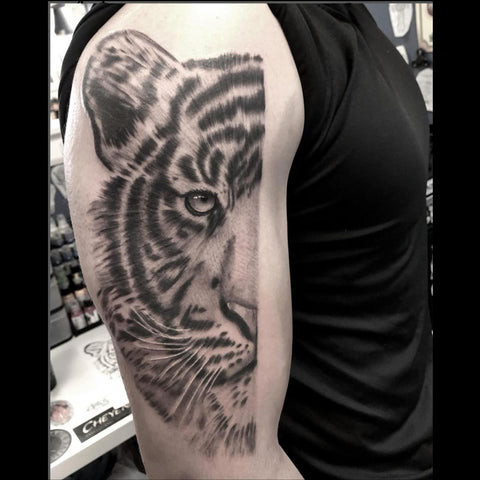 Realism Tattoo of a Tiger with Lifelike Detail