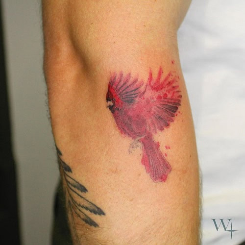 Bold red cardinal bird tattoo for men, symbolizing passion, hope, and territorial strength