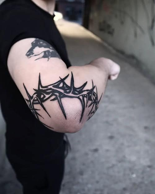 Religious Elbow Tattoo with Cross