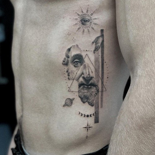 A rib tattoo with shading and depth on a man's side, bold and statement-making