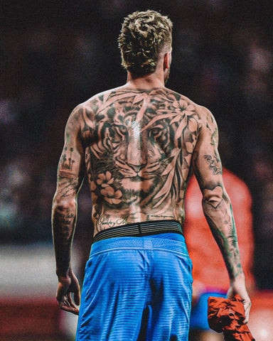 Rodrigo De Paul back tattoo, featuring a fierce tiger symbolizing strength and courage