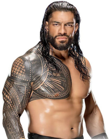 Roman Reigns showcasing a chest and shoulder tattoo, demonstrating a unified and powerful design.