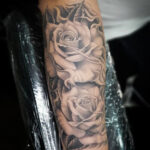 Rose Forearm Tattoo for Men in Black and Grey with Detailed Shading