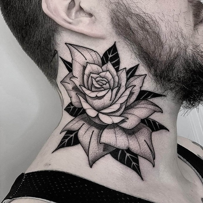 Blackwork style rose tattoo covering the back of the neck with intricate shading and patterns.