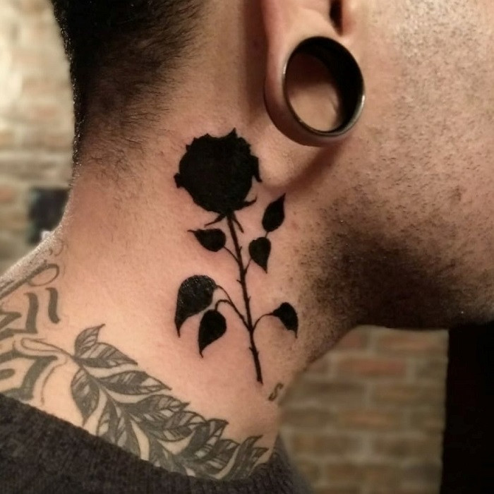 White ink rose neck tattoo, subtle and delicate against the skin.