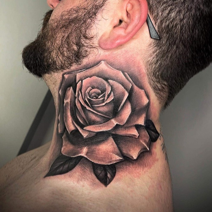 Rose and thorns neck tattoo, representing beauty and pain intertwined.